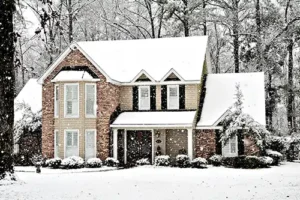 Design-Air Heating & Air Conditioning—A house in Decatur, IL, covered in snow during the winter season.